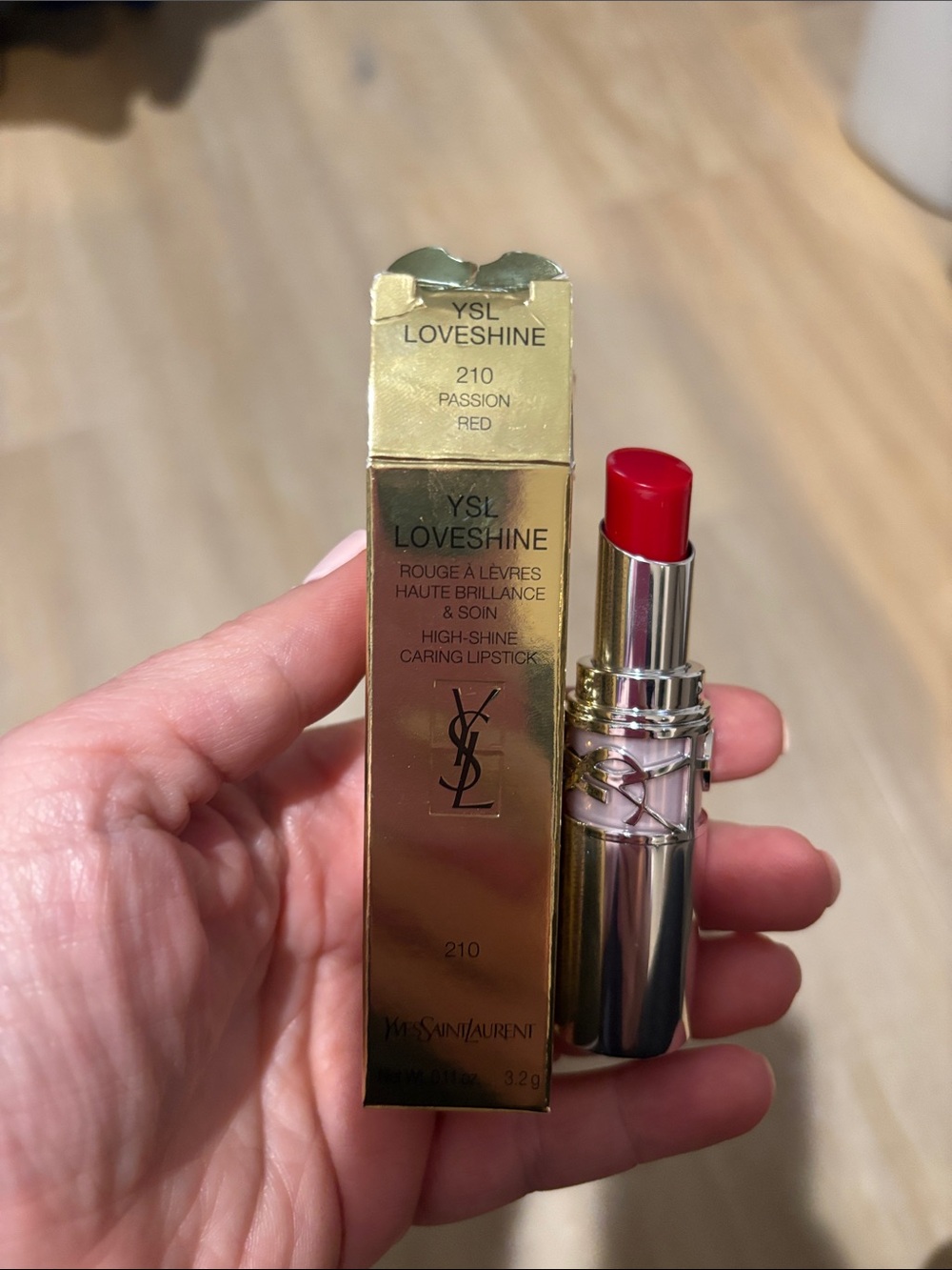 Yves Saint Laurent LoveShine Lipstick — Passion Red (210) has a nick